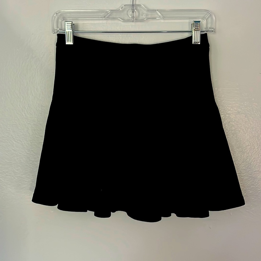 Black pleated skirt.